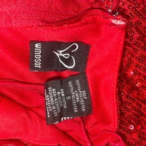 Red sequin long dress with slit.